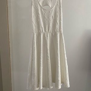White Size small boutique dress. Fit and flare with raised pattern. Not see-thru